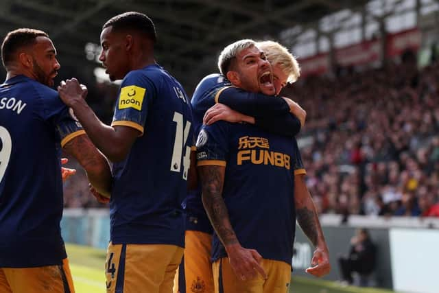 BRENTFORD, ENGLAND - APRIL 08: Bruno Guimaraes of Newcastle United celebrates after teammate Alexander Isak (2L) scores the team's second goal during the Premier League match between Brentford FC and Newcastle United at Brentford Community Stadium on April 08, 2023 in Brentford, England. (Photo by Alex Pantling/Getty Images)