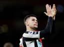 Newcastle United middielder Bruno Guimaraes applauds Newcastle United fans at the Emirates Stadium earlier this month.