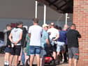 Supporters were forced to stand in the blazing sun