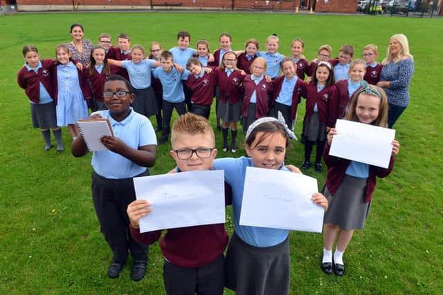 St Bede's Primary School children have sent personal letters to England player Marcus Rashford, Bukayo Saka and Jadon Sancho following racist abuse after the Euro 2020 final defeat. From left Ivan Murwisi, nine, Joshua Rixom, nine, Jessica Roberts, nine and Lainey Bradley, nine with teacher Jessica Romano and teaching assistant Sharon Hunt.