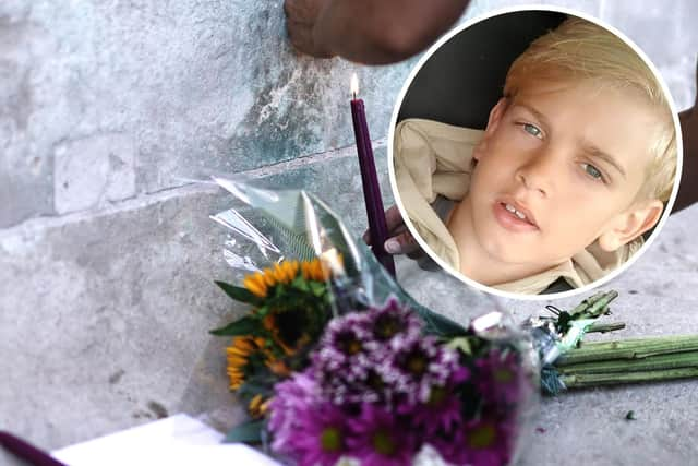 Archie Battersbee, inset, died on Saturday, August 6 after his treatment was withdrawn. Candles have been lit and flowers have been left outside the Royal London Hospital in Whitechapel. Pictures: Hollie Dance/PA.