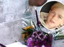 Archie Battersbee, inset, died on Saturday, August 6 after his treatment was withdrawn. Candles have been lit and flowers have been left outside the Royal London Hospital in Whitechapel. Pictures: Hollie Dance/PA.