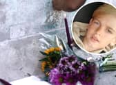 Archie Battersbee, inset, died on Saturday, August 6 after his treatment was withdrawn. Candles have been lit and flowers have been left outside the Royal London Hospital in Whitechapel. Pictures: Hollie Dance/PA.