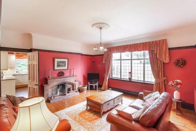 The family room has a fireplace and window overlooking the rear garden.
