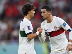 Cristiano Ronaldo of Portugal speaks with Joao Felix of Portugal during the FIFA World Cup Qatar 2022 quarter final match between Morocco/Spain and Portugal/Switzerland at Al Thumama Stadium on December 10, 2022 in Doha, Qatar. (Photo by Justin Setterfield/Getty Images)