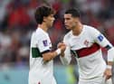 Cristiano Ronaldo of Portugal speaks with Joao Felix of Portugal during the FIFA World Cup Qatar 2022 quarter final match between Morocco/Spain and Portugal/Switzerland at Al Thumama Stadium on December 10, 2022 in Doha, Qatar. (Photo by Justin Setterfield/Getty Images)