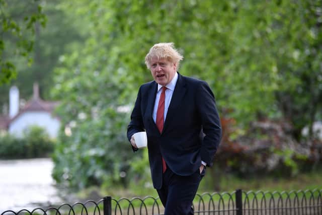 Prime Minister Boris Johnson takes a morning walk in St James's Park in London on Monday, May 11. Picture: PA.