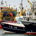 Fishing boats moored in the port of Boulogne, France. Environment Secretary George Eustice has warned France the UK could retaliate if it goes ahead with threats in the fishing row, warning that "two can play at that game". Picture date: Friday October 29, 2021.