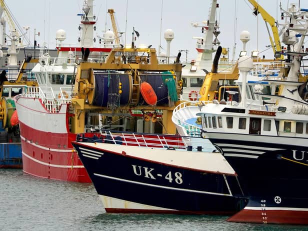 Fishing boats moored in the port of Boulogne, France. Environment Secretary George Eustice has warned France the UK could retaliate if it goes ahead with threats in the fishing row, warning that "two can play at that game". Picture date: Friday October 29, 2021.