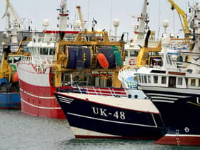 Fishing boats moored in the port of Boulogne, France. Environment Secretary George Eustice has warned France the UK could retaliate if it goes ahead with threats in the fishing row, warning that "two can play at that game". Picture date: Friday October 29, 2021.