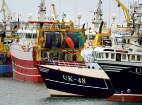 Fishing boats moored in the port of Boulogne, France. Environment Secretary George Eustice has warned France the UK could retaliate if it goes ahead with threats in the fishing row, warning that "two can play at that game". Picture date: Friday October 29, 2021.