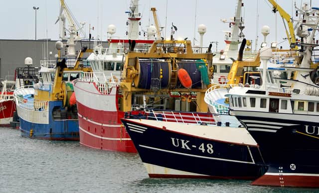 Fishing boats moored in the port of Boulogne, France. Environment Secretary George Eustice has warned France the UK could retaliate if it goes ahead with threats in the fishing row, warning that "two can play at that game". Picture date: Friday October 29, 2021.