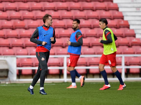 Sunderland players warm up ahead of Swindon Town clash.