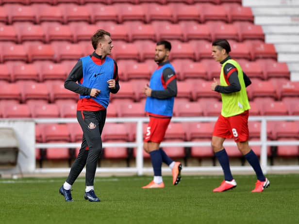 Sunderland players warm up ahead of Swindon Town clash.
