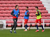 Sunderland players warm up ahead of Swindon Town clash.