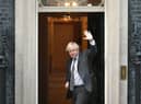 Prime Minister Boris Johnson waves as he returns to Downing Street, London, after legislation to ratify the EU (Future Relationship) Bill cleared its first Commons hurdle with MPs giving it a second reading by 521 votes to 73, a majority of 448.