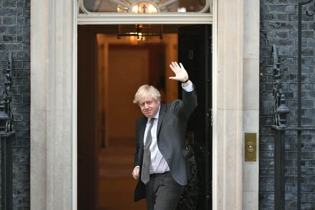 Prime Minister Boris Johnson waves as he returns to Downing Street, London, after legislation to ratify the EU (Future Relationship) Bill cleared its first Commons hurdle with MPs giving it a second reading by 521 votes to 73, a majority of 448.