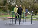 Councillor Joan Atkinson is pictured with Paul Fairley, of Play Fitness, overseeing the installation of a new level roundabout in the play area at Cleadon Recreation Ground.