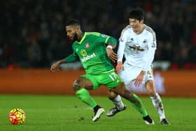 Jeremain Lens of Sunderland and Ki Sung-Yeung of Swansea City compete for the ball during the Barclays Premier League match between Swansea City and Sunderland at the Liberty Stadium.