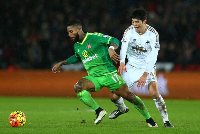Jeremain Lens of Sunderland and Ki Sung-Yeung of Swansea City compete for the ball during the Barclays Premier League match between Swansea City and Sunderland at the Liberty Stadium.