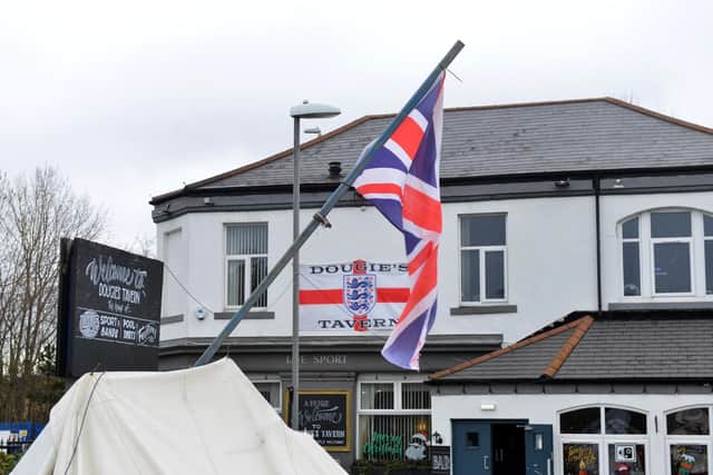 Notably the Union Jack survived the destruction at Dougie's Tavern.