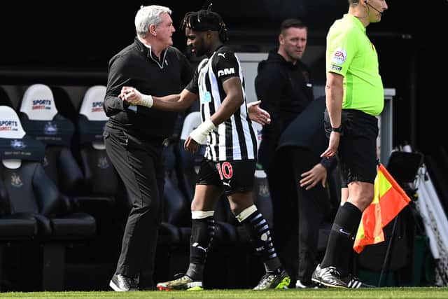 Newcastle player Allan Saint -Maximin is congratulated by manager Steve Bruce after being substituted during the Premier League match between Newcastle United and West Ham United at St. James Park
