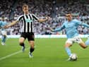 Phil Foden of Manchester City attempts to cross the ball past Emil Krafth of Newcastle United during the Premier League match between Newcastle United and Manchester City at St. James Park on August 21, 2022 in Newcastle upon Tyne, England. (Photo by Clive Brunskill/Getty Images)