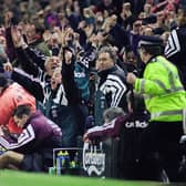 Kevin Keegan reacts to Stan Collymore's injury-time winner for Liverpool as the home bench celebrate.