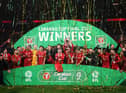 Jordan Henderson of Liverpool lifts the Carabao Cup trophy following victory in the Carabao Cup Final match between Chelsea and Liverpool at Wembley Stadium on February 27, 2022. (Photo by Shaun Botterill/Getty Images)