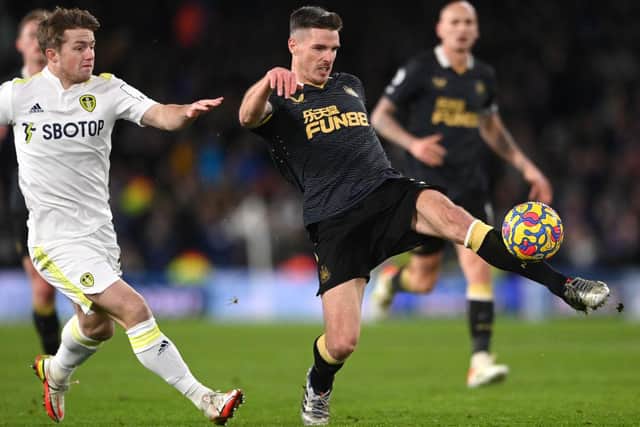 Ciaran Clark (r) clears under pressure from Joe Gelhardt of Leeds during the Premier League match between Leeds United  and  Newcastle United at Elland Road on January 22, 2022 in Leeds, England. (Photo by Stu Forster/Getty Images)