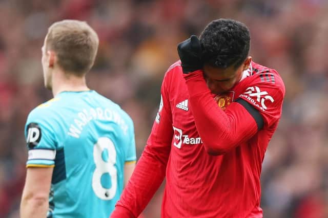 Casemiro of Manchester United looks dejected as he leaves the pitch after being shown a red card during the Premier League match between Manchester United and Southampton FC at Old Trafford on March 12, 2023 in Manchester, England. (Photo by Nathan Stirk/Getty Images)