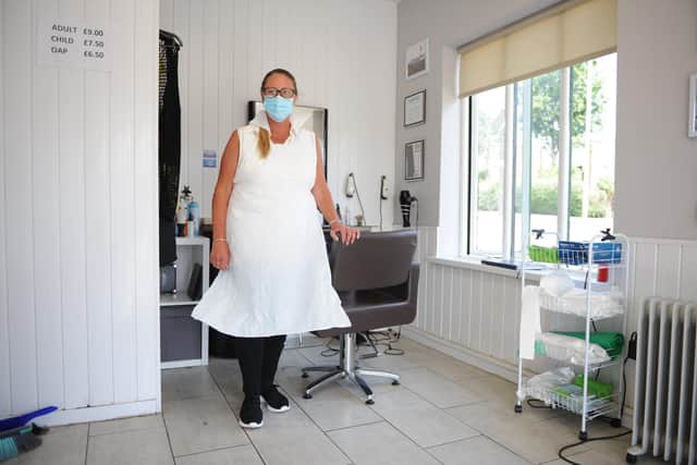 The Barber Shop owner Sharon Pittuck is continuing to wear PPE despite restrictions being lifted.