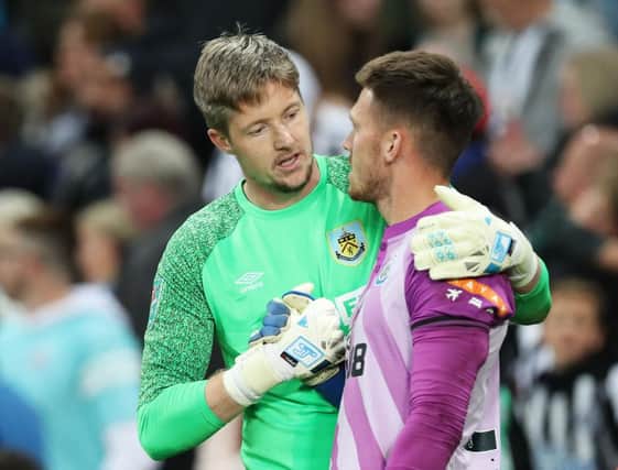 Wayne Hennessey of Burnley shakes hands with Freddie Woodman of Newcastle United after the penalty shootout during the Carabao Cup Second Round. (Photo by Ian MacNicol/Getty Images)