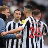 Newcastle United head coach Eddie Howe embraces midfielder Miguel Almiron.
