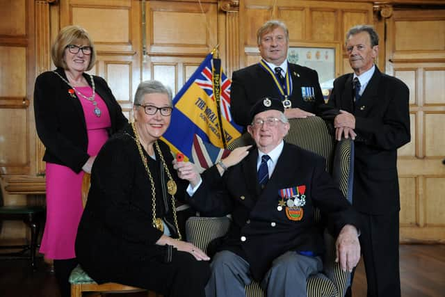 The Mayor of South Tyneside Cllr Pat Hay receives the first poppy from the Royal British Legion South Shields Branch President Peter Boyack, with Mayoress Mrs Jean Copp, Branch Chairman Anthony Paterson, and Branch Secretary George Coser, at South Shields Town Hall.