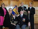The Mayor of South Tyneside Cllr Pat Hay receives the first poppy from the Royal British Legion South Shields Branch President Peter Boyack, with Mayoress Mrs Jean Copp, Branch Chairman Anthony Paterson, and Branch Secretary George Coser, at South Shields Town Hall.