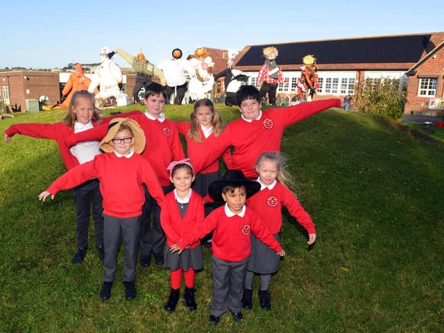 Marsden Primary School children with their scarecrow designs.