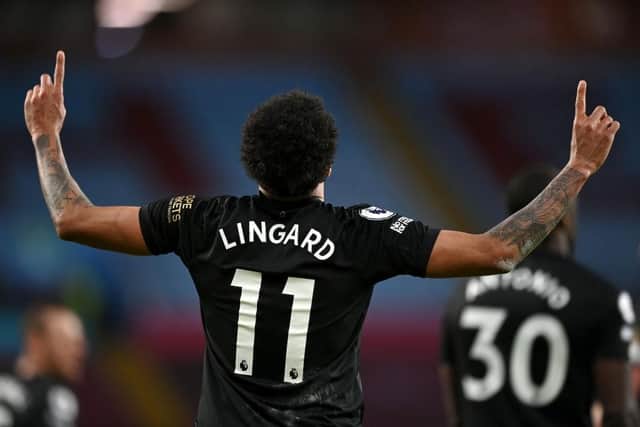 Jesse Lingard of West Ham United celebrates after scoring his team's third goal during the Premier League match between Aston Villa and West Ham United at Villa Park on February 03, 2021 in Birmingham, England. Sporting stadiums around the UK remain under strict restrictions due to the Coronavirus Pandemic as Government social distancing laws prohibit fans inside venues resulting in games being played behind closed doors. (Photo by Shaun Botterill/Getty Images)