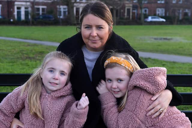 Harriet Corr (left), six, with big sister Nancy, nine and their mam Emma. Picture by Stu Norton.