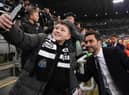 Newcastle United co-owner Mehrdad Ghodoussi poses for a photo with a young fan prior to the Carabao Cup Semi Final 2nd Leg match between Newcastle United and Southampton at St James' Park on January 31, 2023 in Newcastle upon Tyne, England. (Photo by Stu Forster/Getty Images)