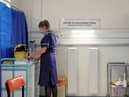 A nurse prepares a cubicle in the Covid-19 Vaccination Clinic at the University Hospital in Coventry, prior to the NHS administering jabs to the most vulnerable early next week. Picture: Steve Parsons/Pool/AFP via Getty Images.