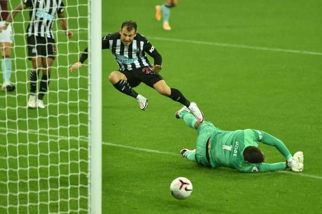 NEWCASTLE UPON TYNE, ENGLAND - OCTOBER 03: Nick Pope of Burnley fouls Ryan Fraser of Newcastle United leading to Newcastle United being awarded a penalty during the Premier League match between Newcastle United and Burnley at St. James Park on October 03, 2020 in Newcastle upon Tyne, England.