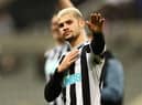 Bruno Guimaraes of Newcastle United acknowledges the fans following the Premier League match between Newcastle United and Wolverhampton Wanderers at St. James Park on March 12, 2023 in Newcastle upon Tyne, England. (Photo by Naomi Baker/Getty Images)