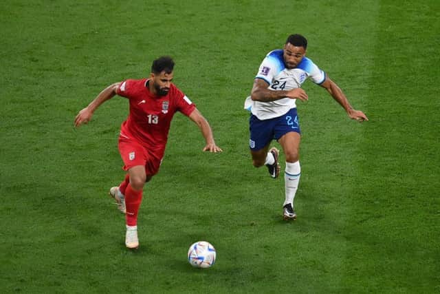 Hossein Kanani of IR Iran and Callum Wilson of England compete for the ball during the FIFA World Cup Qatar 2022 Group B match between England and IR Iran at Khalifa International Stadium on November 21, 2022 in Doha, Qatar. (Photo by Justin Setterfield/Getty Images)