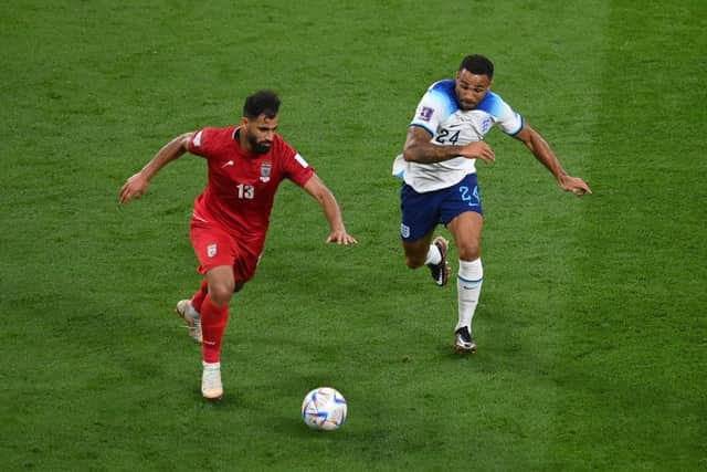 Hossein Kanani of IR Iran and Callum Wilson of England compete for the ball during the FIFA World Cup Qatar 2022 Group B match between England and IR Iran at Khalifa International Stadium on November 21, 2022 in Doha, Qatar. (Photo by Justin Setterfield/Getty Images)