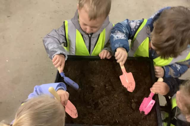 Green-fingered youngsters from Nurserytime got to work at Hebburn Cemetery's new greenhouses.