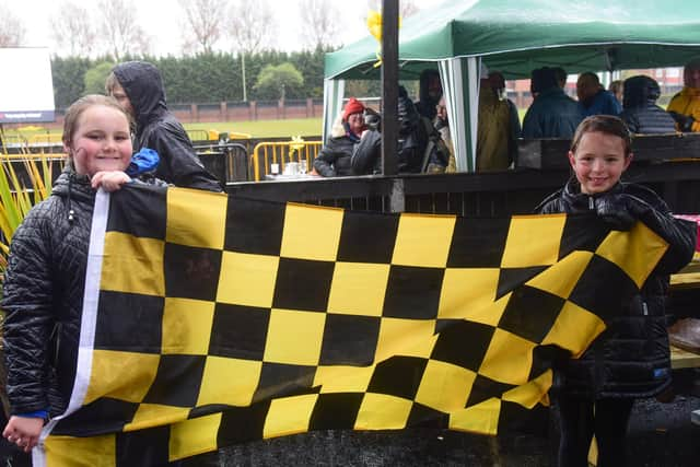 Young supporters Olivia Dodgson (left) and Amelia Brown show their colours