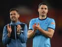Fabian Schar of Newcastle United (R) and assistant head coach Jason Tindall applaud the travelling fans at the end of the Premier League match between Southampton and Newcastle United at St Mary's Stadium on March 10, 2022 in Southampton, England.  (Photo by Mike Hewitt/Getty Images)