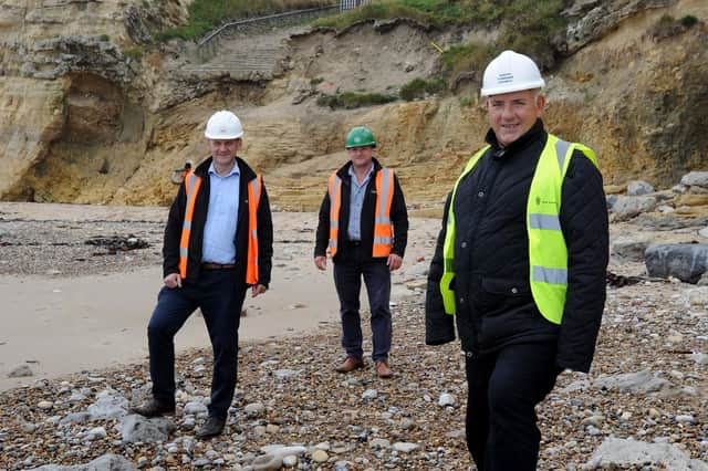 South Tyneside Council Cllr Ernest Gibson with ESH Construction contract manager Stephen McClean and project manager Steve Marshall at site of new staircase to access Marsden Beach.