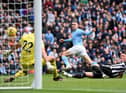 Phil Foden of Manchester City scores the team's first goal during the Premier League match between Manchester City and Newcastle United at Etihad Stadium on March 04, 2023 in Manchester, England. (Photo by Laurence Griffiths/Getty Images)